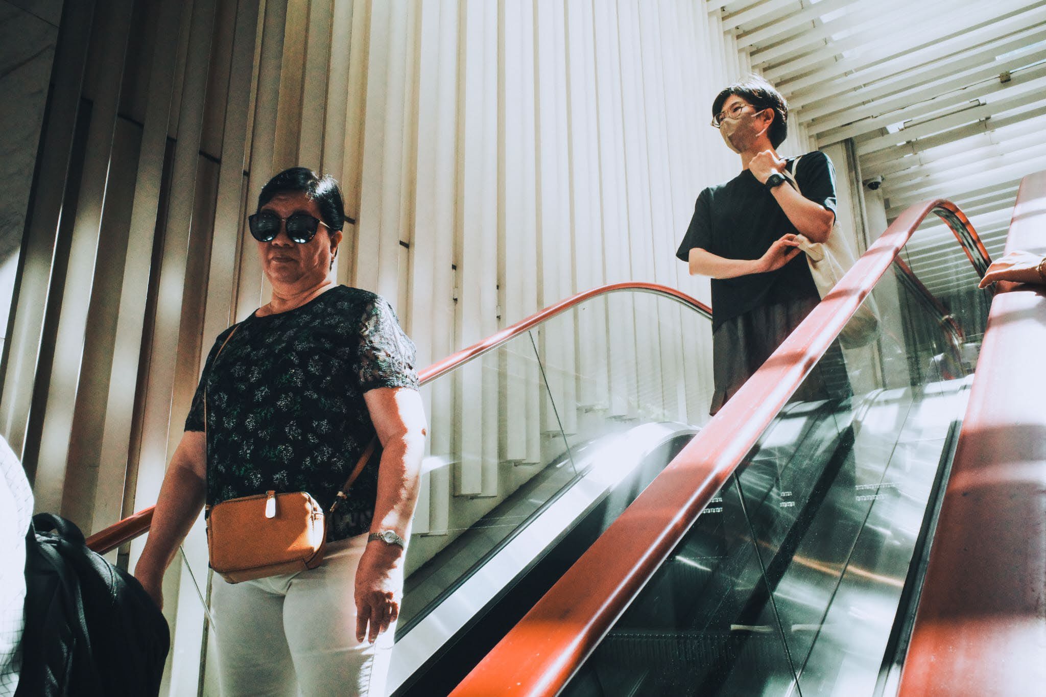 A person riding an escalator