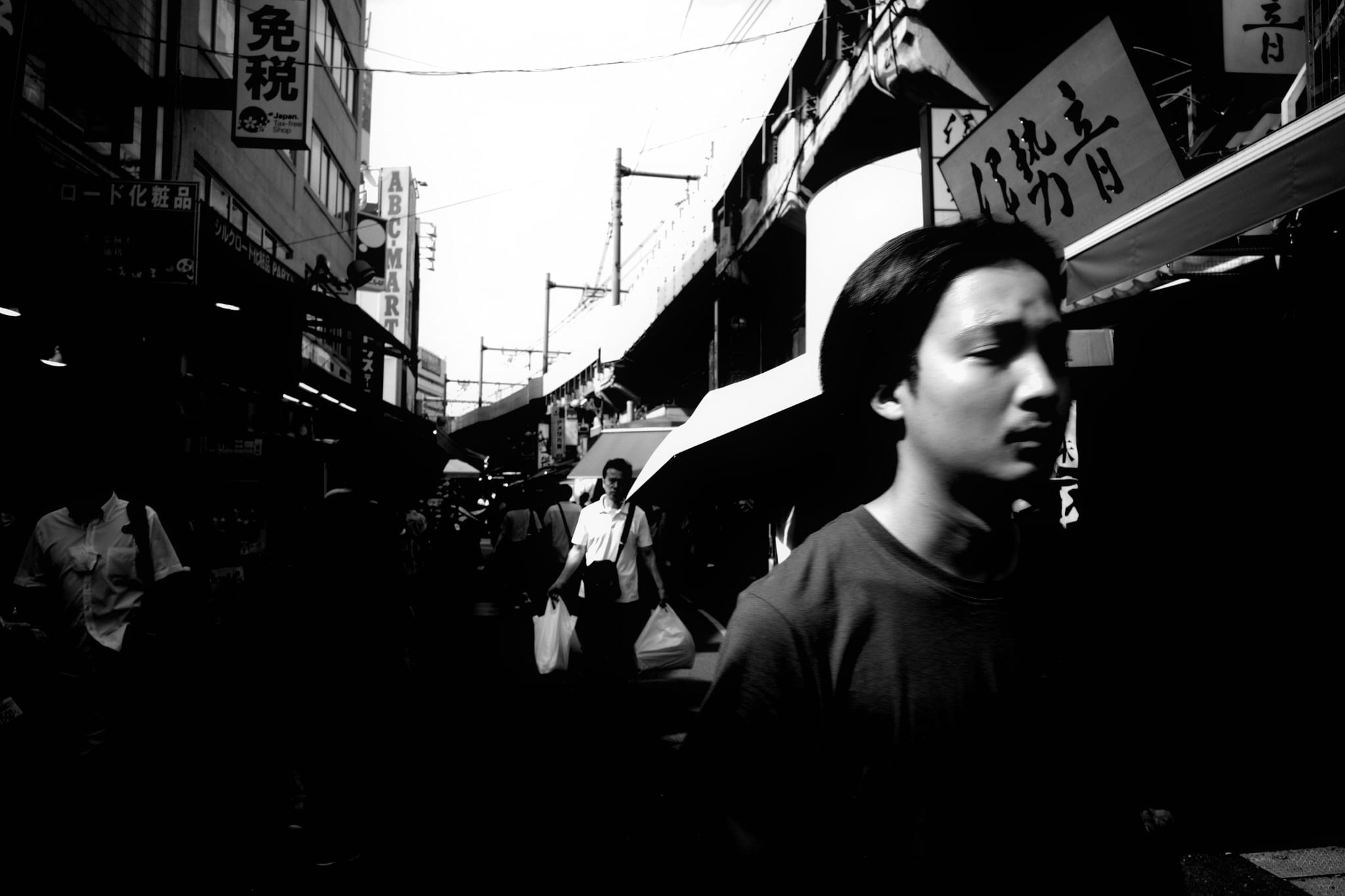 A young woman looking across a busy street